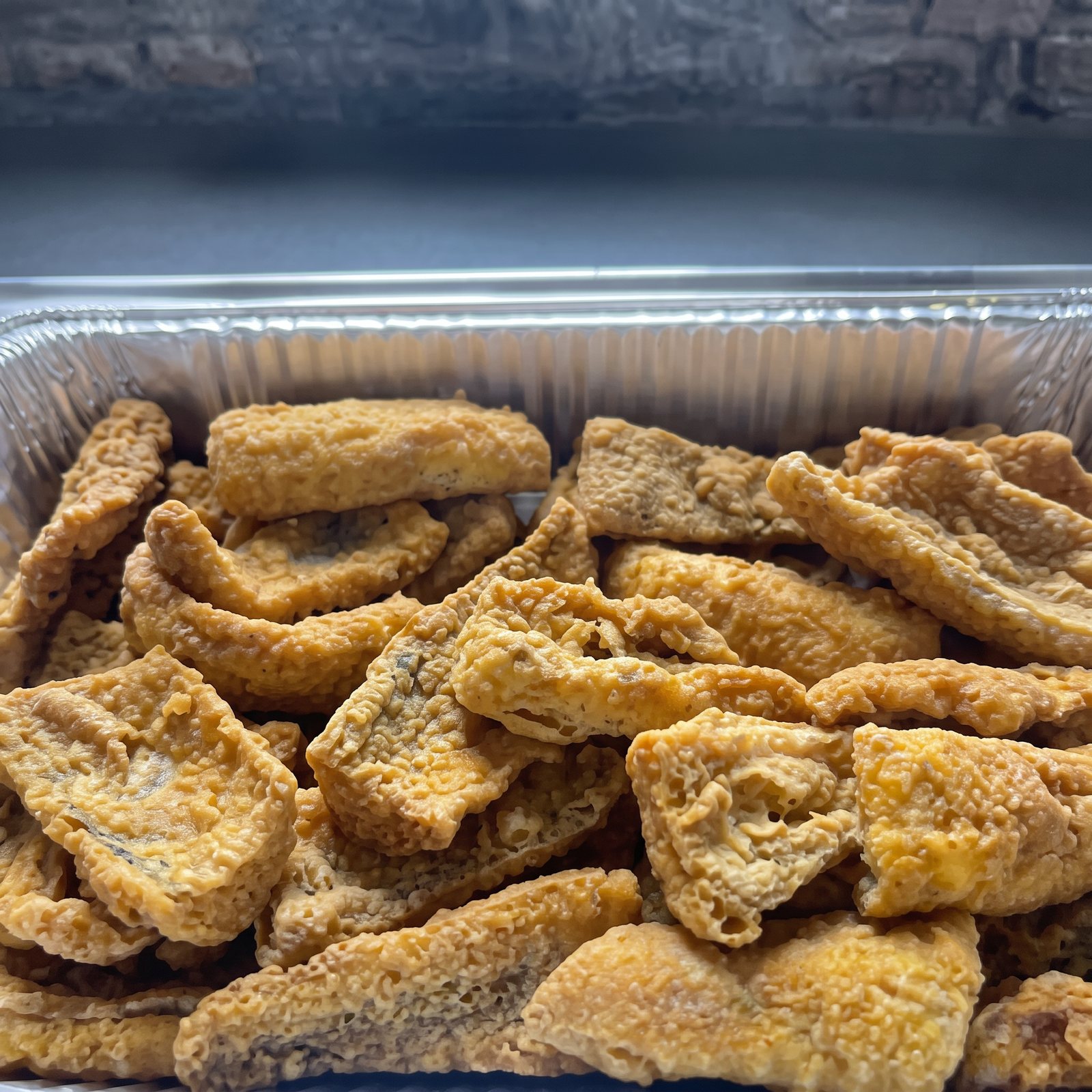 Tray of golden homemade fried fish