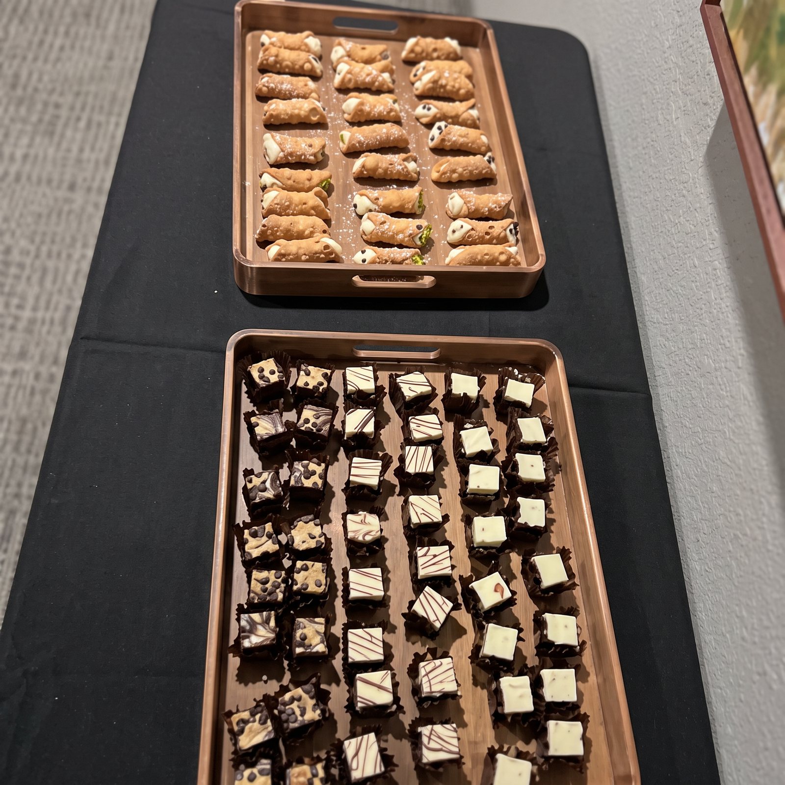 Trays of homemade cheesecake bites and pastries